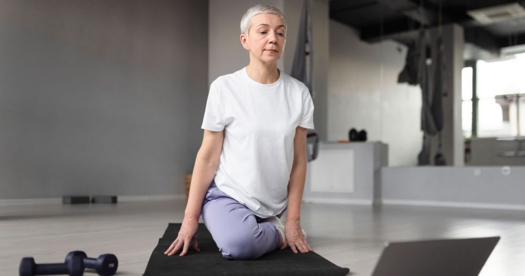 A person doing a seated twist.
